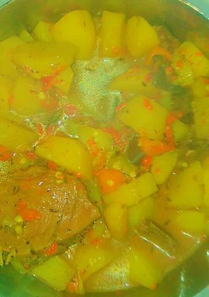 A picture of Potatoes, carrot and assorted meat soup.