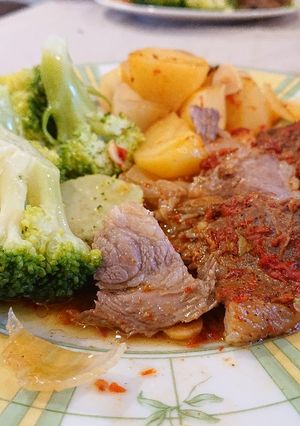 A picture of Roast Lamb with Potatoes.