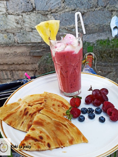 A picture of Pineapple, blueberry, grapes, strawberry, and raspberry juice...