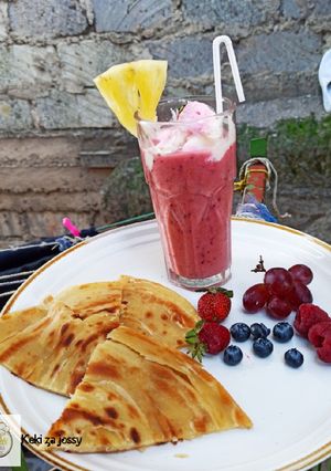 A picture of Pineapple, blueberry, grapes, strawberry, and raspberry juice...