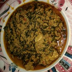 A picture of Egusi soup wit ugu leaves.