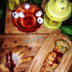 Mummy kabab wrapped, hand garlic toast and eyeball punch A picture of Mummy kabab wrapped, hand garlic toast and eyeball punch.