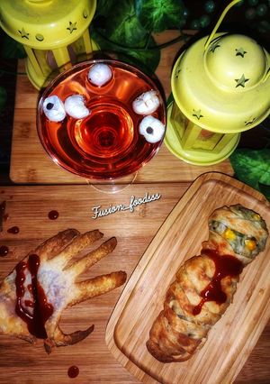 A picture of Mummy kabab wrapped, hand garlic toast and eyeball punch.