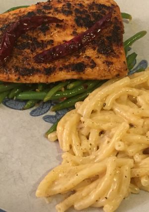 A picture of Blackened Salmon with Green Beans and Cajun Gouda Mac 🌶.