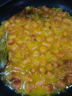 Una foto de Salchichas encebolladas