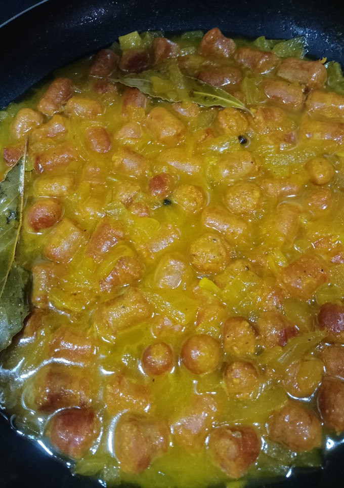 Una foto de Salchichas encebolladas