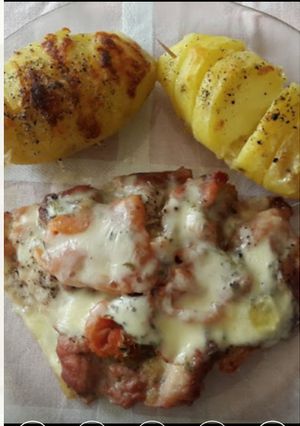 Una foto de Conejo a la napolitana con papas a la sueca