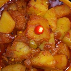 A picture of Kanta (fish bones) veggies curry.