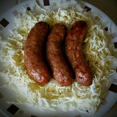 A picture of Bratwurst and Coleslaw.