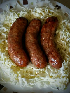 A picture of Bratwurst and Coleslaw.