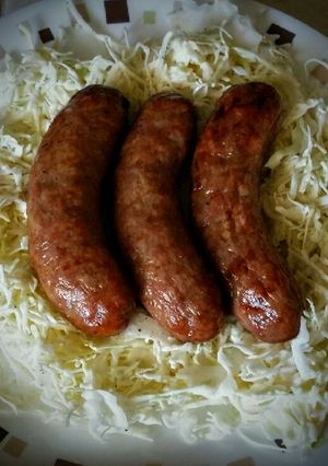 A picture of Bratwurst and Coleslaw.