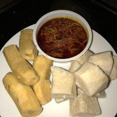 A picture of Boiled plantain and yam with Akpaka sauce.