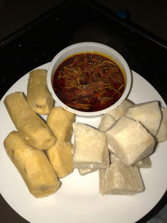 A picture of Boiled plantain and yam with Akpaka sauce.