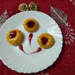 A picture of Mango pudding with strawberry crush.
