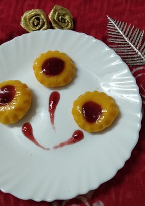 A picture of Mango pudding with strawberry crush.
