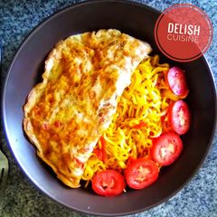 A picture of Noodles and fried eggs.