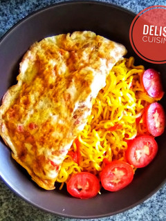A picture of Noodles and fried eggs.