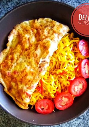 A picture of Noodles and fried eggs.