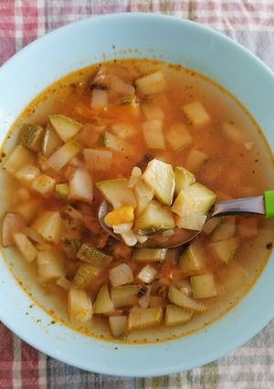 A picture of Zucchini, Squash Blossom, Mushroom, and Corn Soup.