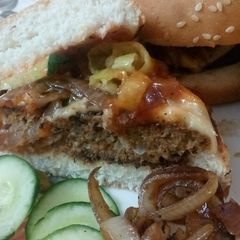 A picture of Beef steak style burgers serve with Apple Mac salad and fries.