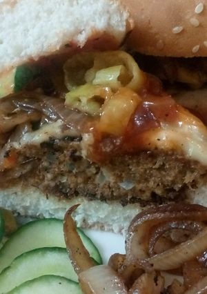 A picture of Beef steak style burgers serve with Apple Mac salad and fries.