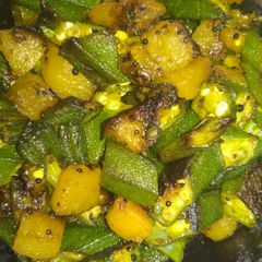 A picture of Lady's finger and pumpkin stir fry.