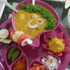 A picture of Stuffed veg kachori dal dhokali.