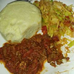 A picture of Beef stew and cabbage.