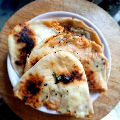 A picture of Aloo kulcha with chhole.