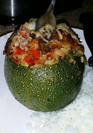 A picture of Round, Stuffed Zucchini with Brown Rice, Ground Beef, Red Pepper.