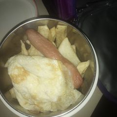 A picture of Fried yam sausage and egg.