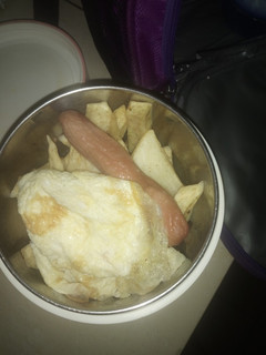 A picture of Fried yam sausage and egg.