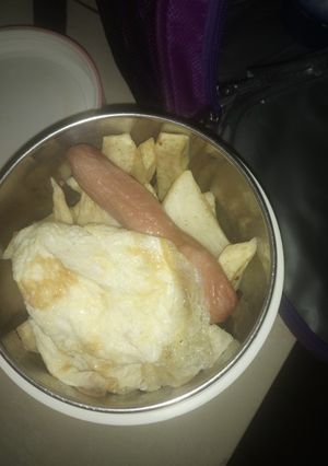 A picture of Fried yam sausage and egg.
