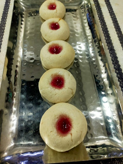 A picture of Thumb Print Jam Cookies with White Butter.
