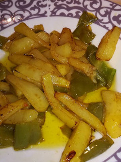 Una foto de Patatas con pimientos