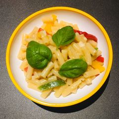 A picture of Macaroni with garlic butter and veg.