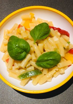A picture of Macaroni with garlic butter and veg.