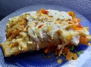 Una foto de canelones espinaca