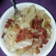 A picture of Apple and cabbage over brown rice.