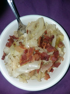A picture of Apple and cabbage over brown rice.