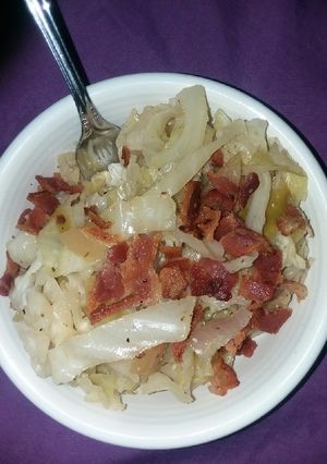 A picture of Apple and cabbage over brown rice.