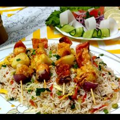 A picture of Vegetables fried rice with shashlak steak.