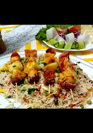 A picture of Vegetables fried rice with shashlak steak.