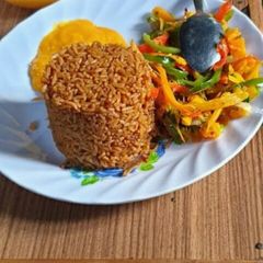 A picture of Beef pilau&stir fried Veggies #foodphotography.
