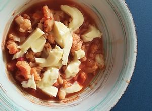 Una foto de Coliflor entomatada con queso