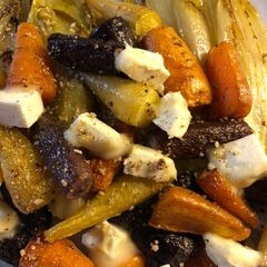 A picture of Rainbow carrots with chicory and goats cheese - vegetarian.