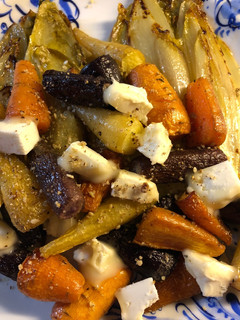 A picture of Rainbow carrots with chicory and goats cheese - vegetarian.
