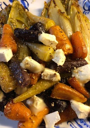 A picture of Rainbow carrots with chicory and goats cheese - vegetarian.