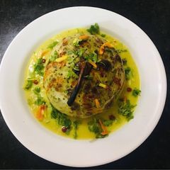 Baked Stuff round dudhi serve with mango curry A picture of Baked Stuff round dudhi serve with mango curry.