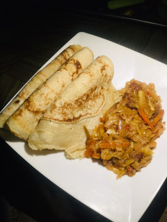 A picture of Pancake with veggie sauce.